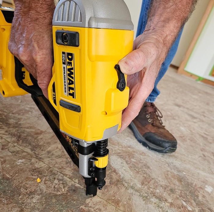 Building contractor using DeWalt Cordless Framing Nailer to fasten subfloor to studs.