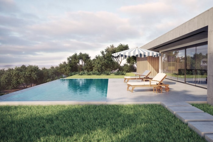 Vue d'une piscine, de deux chaises longues et d'un parasol près d'une belle maison moderne. 