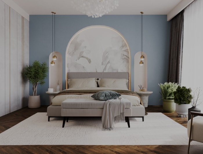 Chambre tendance avec literie blanche et arcades avec mur bleu clair.