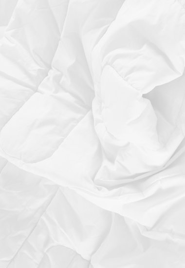 Comment nettoyer une couette en duvet - Détail de la literie