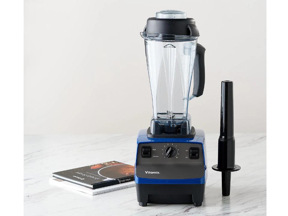 Vitamix Creations II 64-oz 13-in-1 Variable Speed Blender w/Books on marble top white wall behind