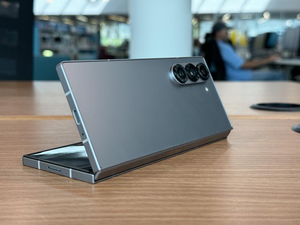 The Samsung Galaxy Fold 6 partially open on a table.