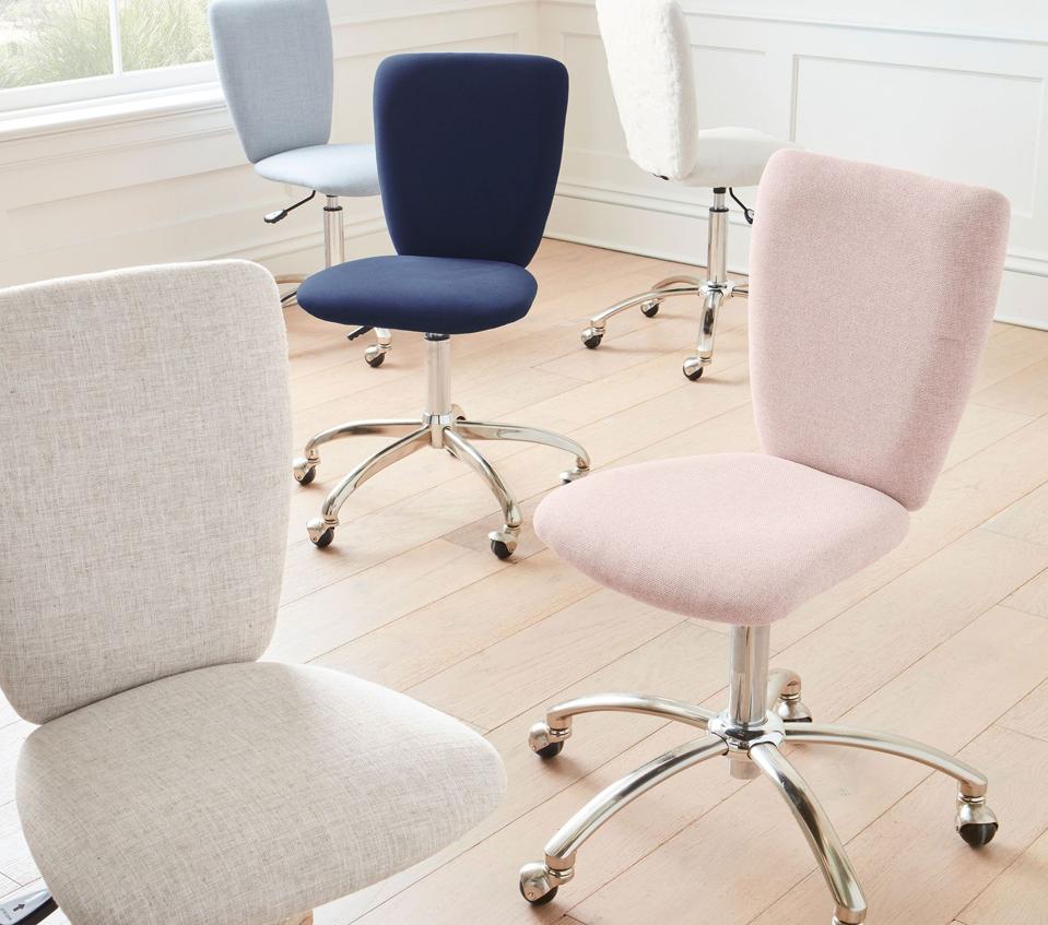 Five Pottery Barn Square Upholstered Desk Chairs in a room with wood flooring