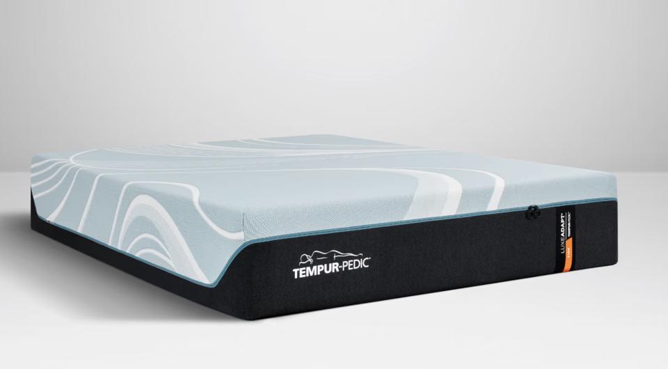 The Tempur-Pedic Tempur-LuxeAdapt Firm mattress against a gray background.