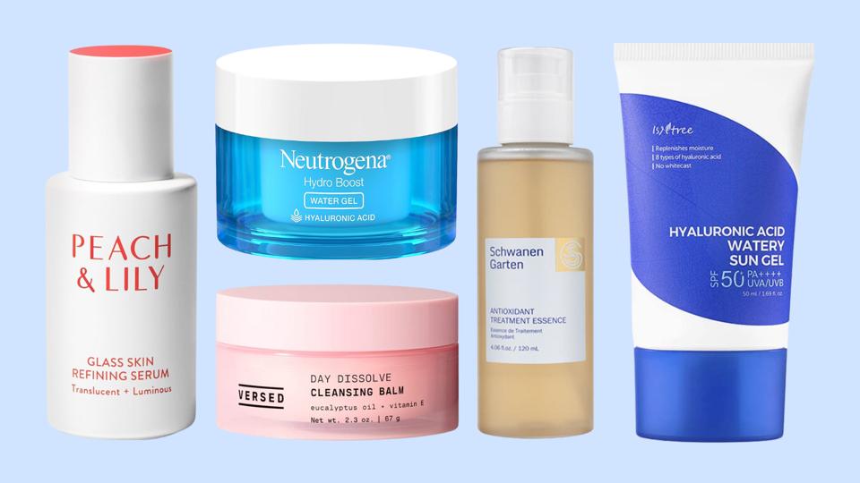 Skincare products against light blue background