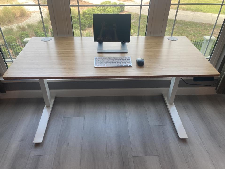 Fully Jarvis desk against a window