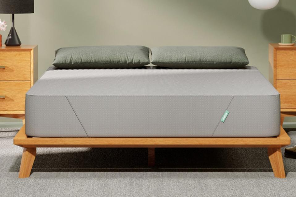 The Siena Mattress in a bedroom on a wooden bed frame.