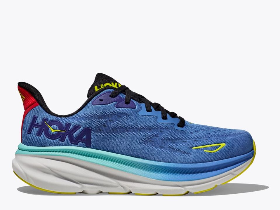 Hoka Clifton 9 in white with blue accents and yellow laces