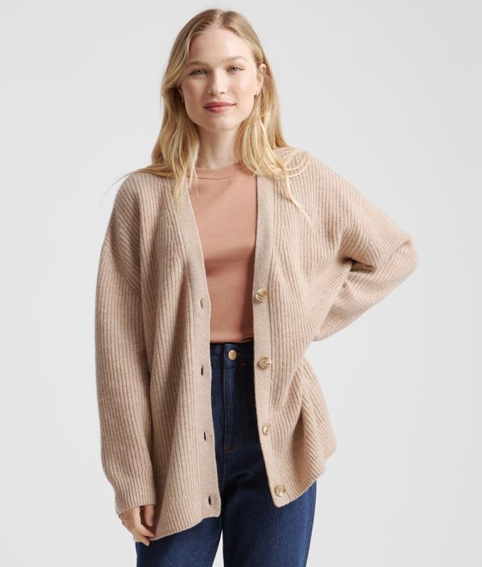 woman wearing a Quince Mongolian Cashmere Oversized Boyfriend Cardigan Sweater in Oatmeal