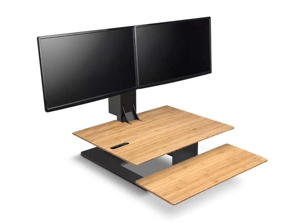 A bamboo E7 Electric Standing Desk Converter on a white background