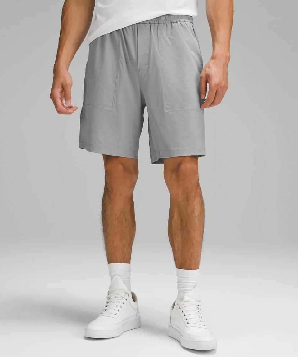 Waist-down shot of a man wearing grey Lululemon Bowline Ripstop shorts.