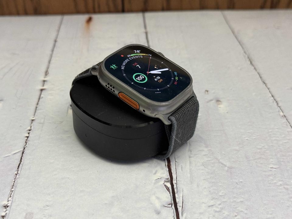 An Apple Watch on a wooden surface.