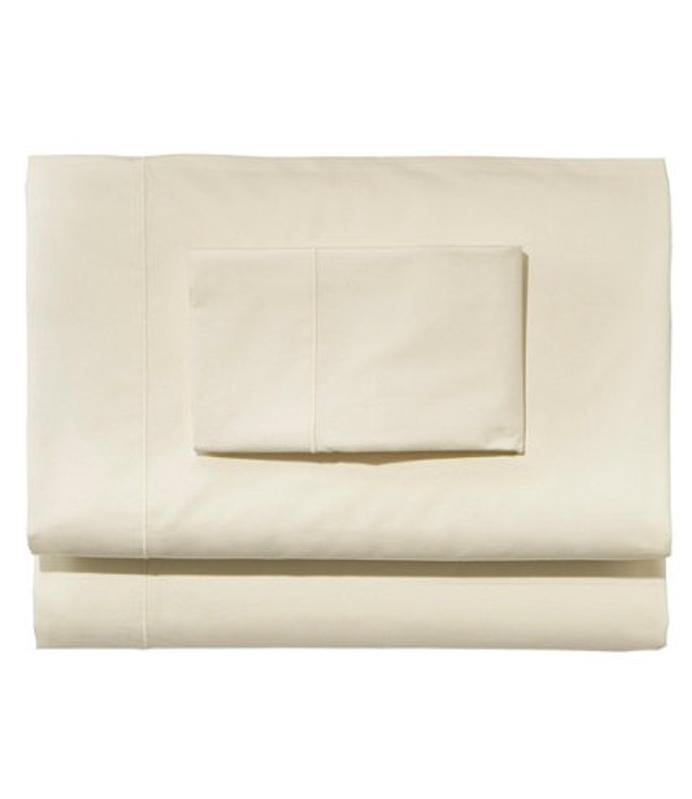 Premium Egyptian Percale Sheet Collection folded and stacked on a white background. 