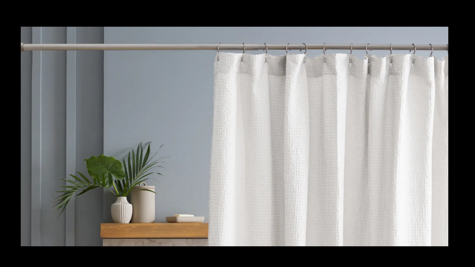 White shower curtain with potted plant in grey background