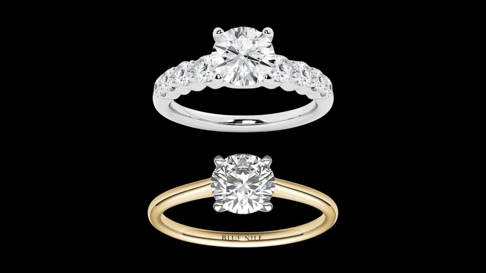 Two engagement rings against a black background