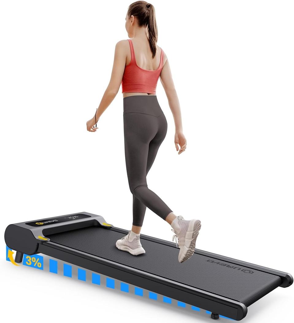 Woman walking on an inclined Urevo Walking Pad