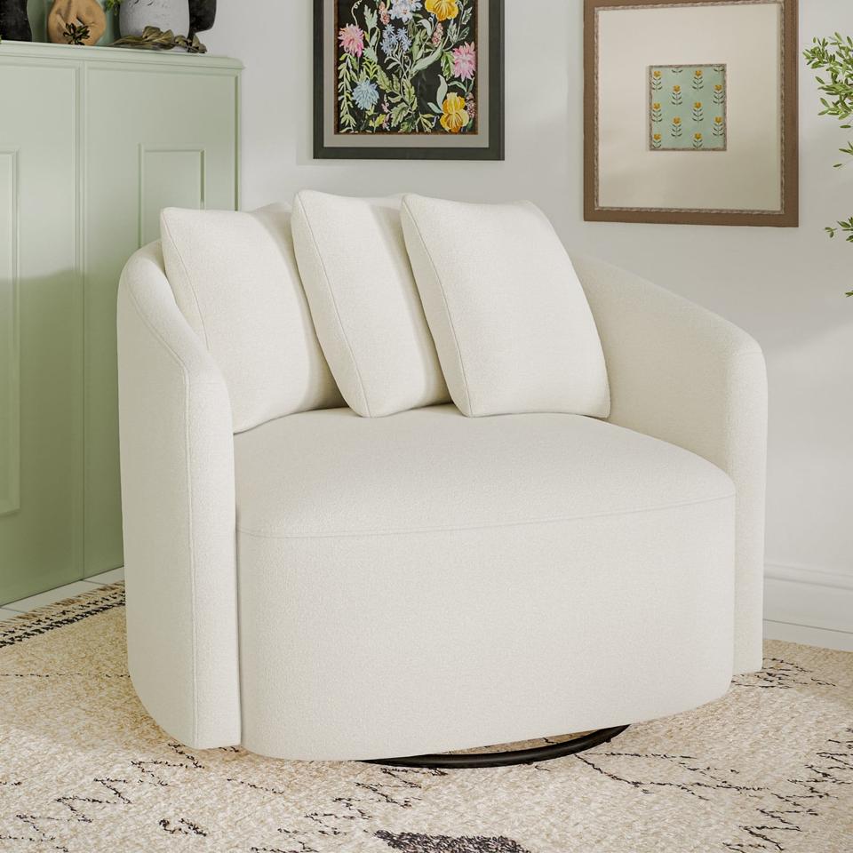 A white Beautiful Drew Chair in a living space in front of a green cabinet