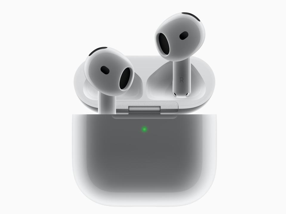 AirPods 4 earbuds with their charging case.