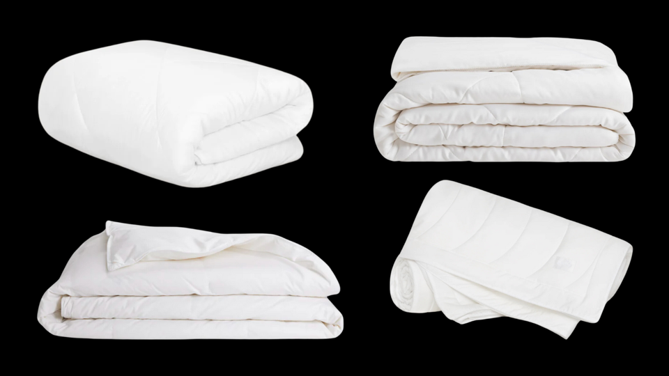 Four white comforters for hot sleepers on a black background