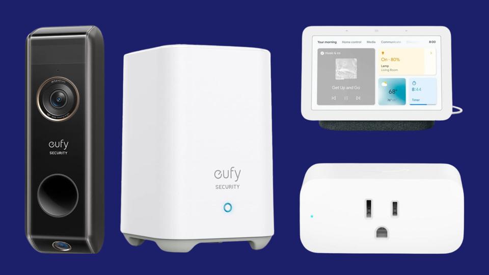 The Eufy Dual Cam Video Doorbell, Nest Hub and Amazon Smart Plug on a dark blue background.