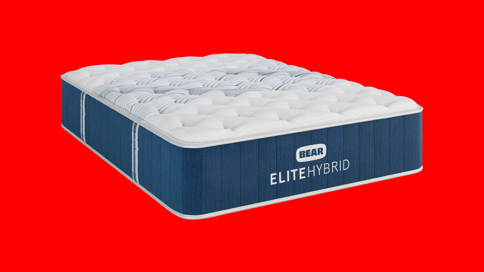 A Bear Elite Hybrid Mattress against a red background. 