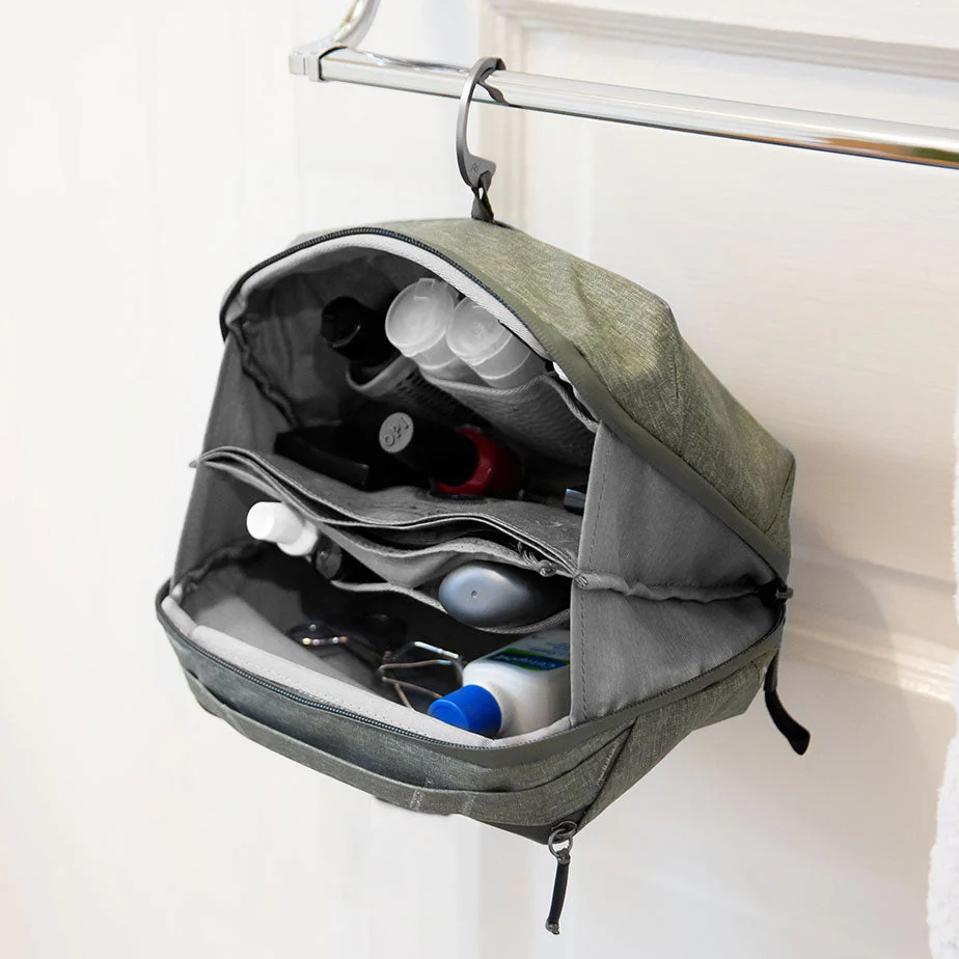 Peak Design Wash Pouch hanging against white wall