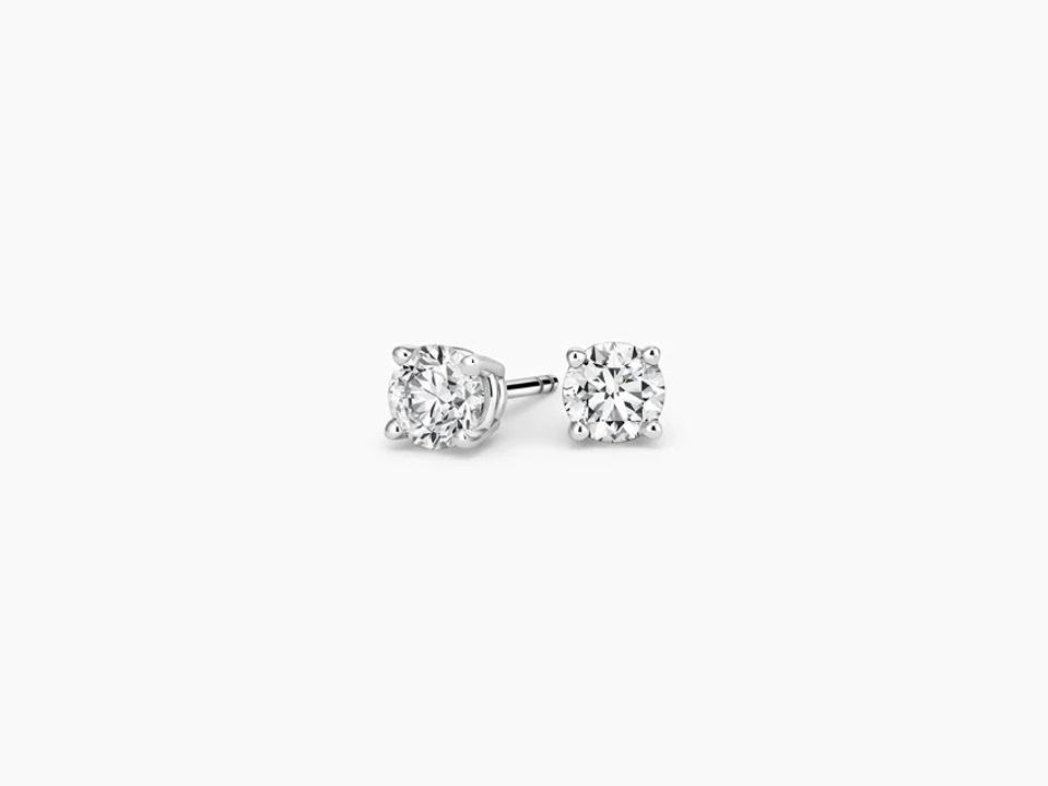 Brilliant Earth diamond studs on white background