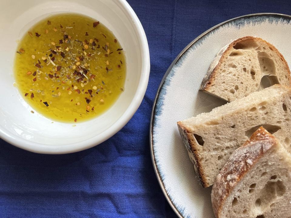 The Castelines EVOO (with parmesan, red pepper flakes and oregano) and freshly baked sourdough bread.