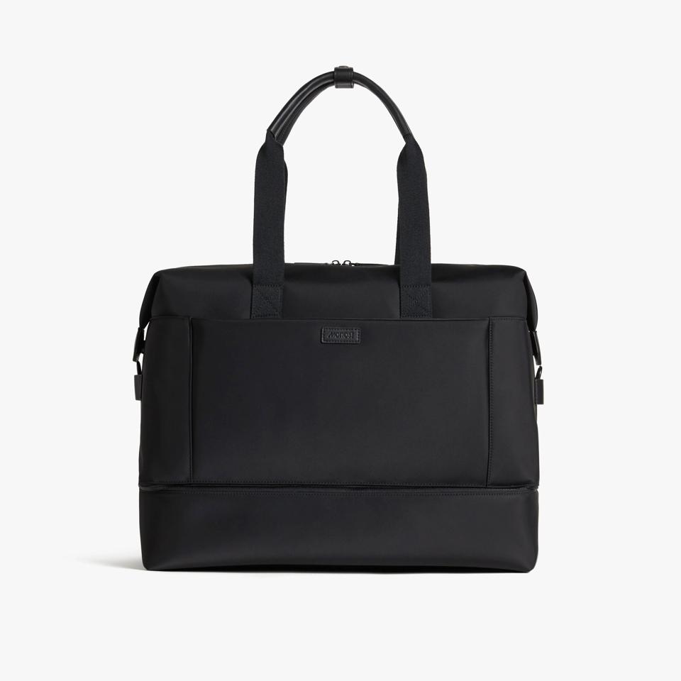 Black weekender bag against a white background.