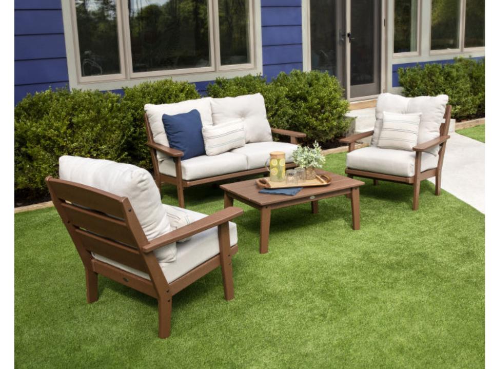 photo of polywood Lakeside 4-Piece Deep Seating Set w/ throws & a pitcher outside on grass