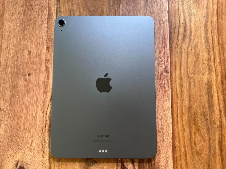 An iPad Air on a wooden table.