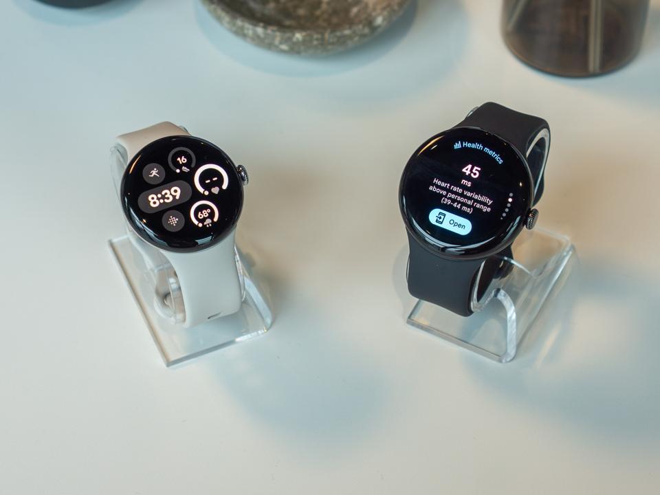 Two Pixel Watches on a tabletop.