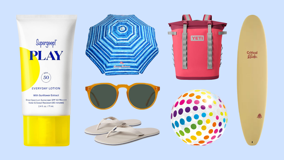 An assortment of beach items against a light blue background