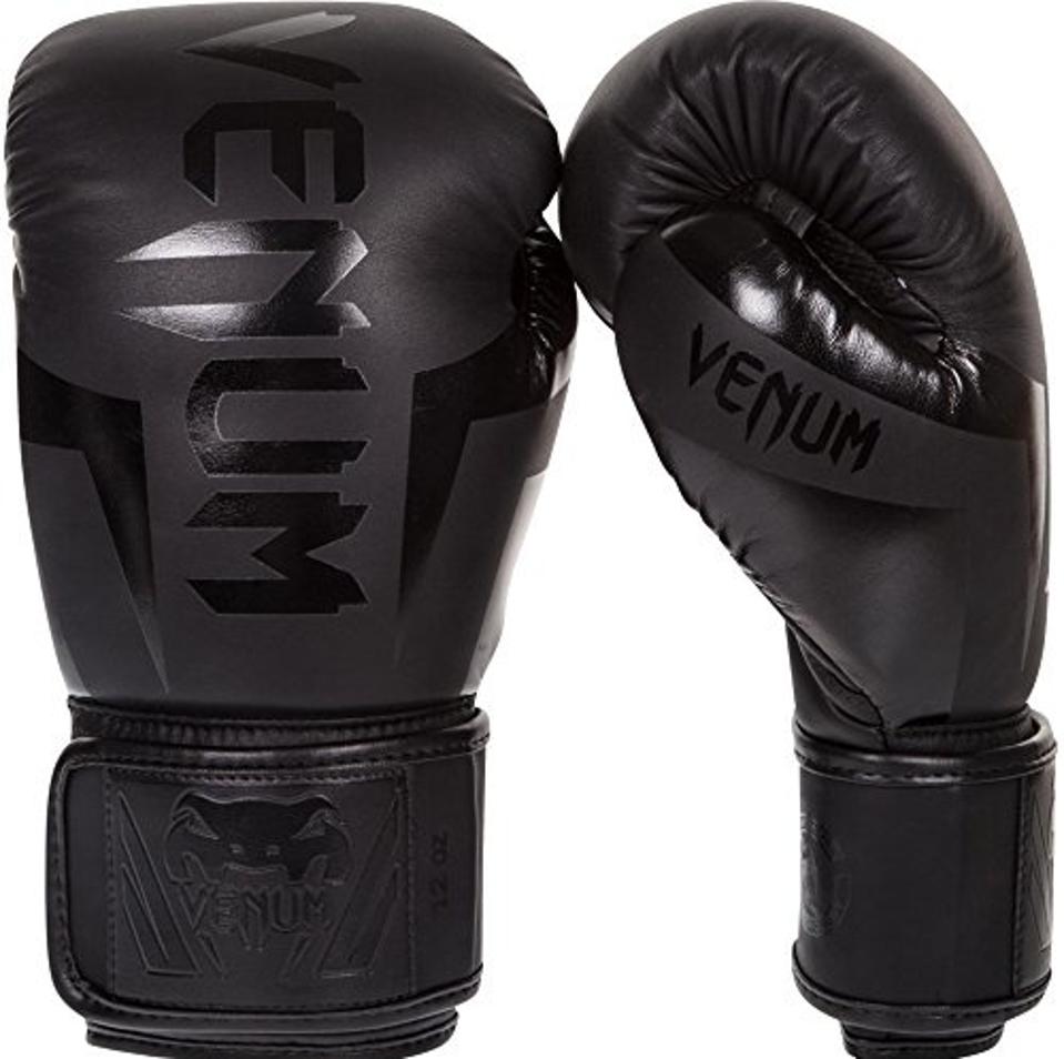 Black Venum Elite Boxing Gloves on a white background