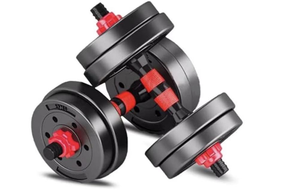 a pair of black and red adjustable dumbbells with multiple weights on each 