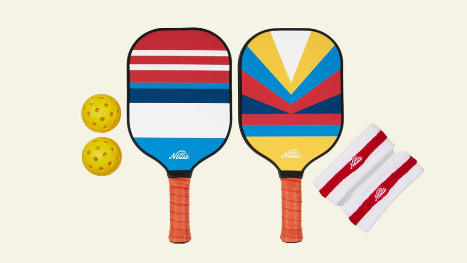 The Nettie Set pickball paddles on a yellow background