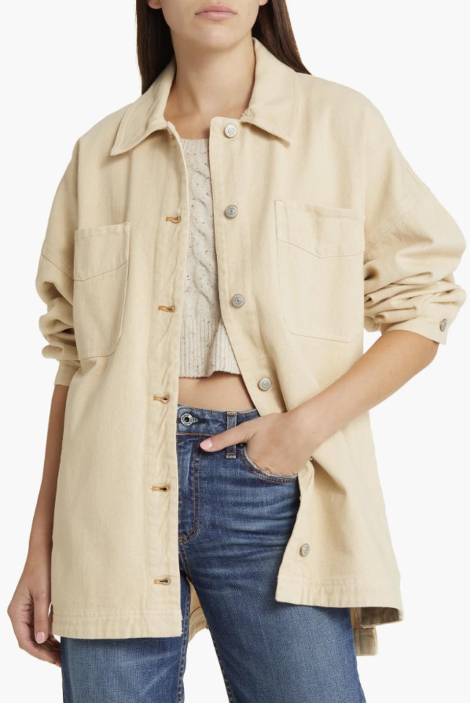 Woman wearing Free People Madison City Twill Jacket in cream against white background.