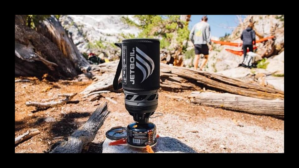 Jetboil Flash camping stove positioned in a wooded scene