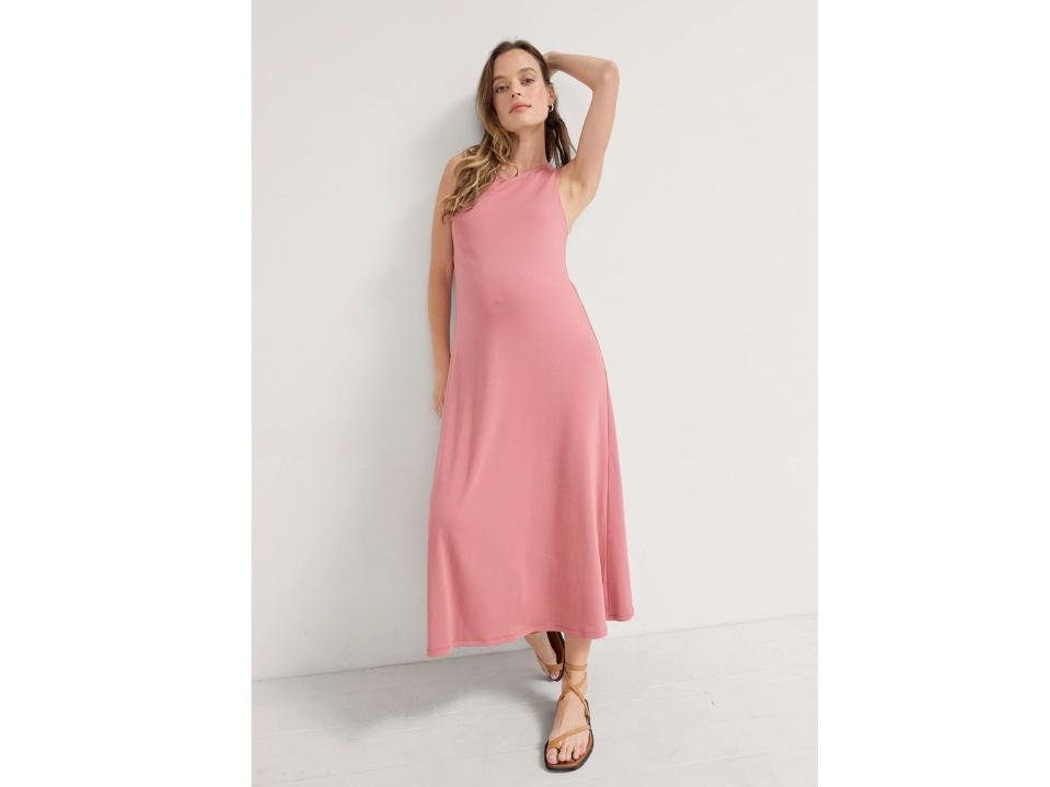 blonde mom wearing pink Hatch the jaime dress against off-white wall