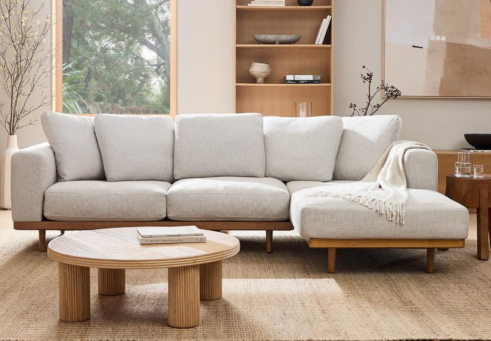 lifestyle shot of a West Elm Newport 2-Piece Chaise Sectional in Dove Coastal linen fabric