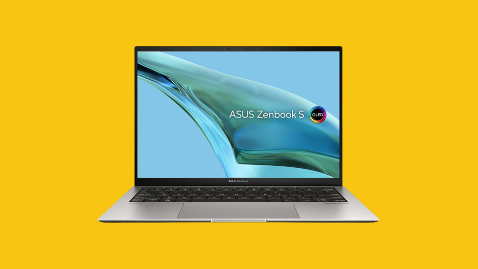 One of the best laptops of 2024, the Asus ZenBook S 13 OLED, against a yellow background.