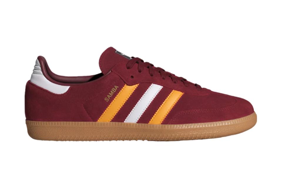 Burgundy Adidas Samba OG sneaker with yellow and white stripes. 