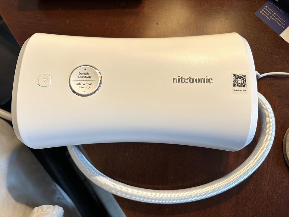 A picture of the Nitetronic unit that has sensitivity control buttons on it.