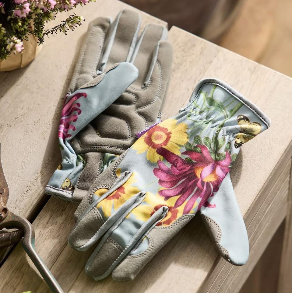 gardening gloves on a wooden table.