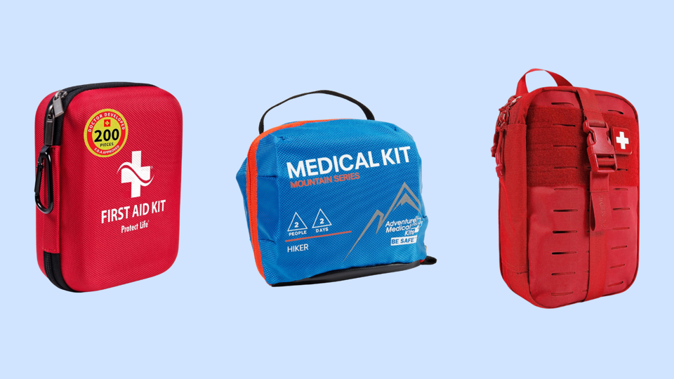 three different first aid kits on a light blue background