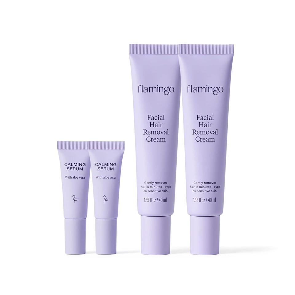 Two large and two small bottles of Flamingo Facial Hair Removal Cream in a row on white background.