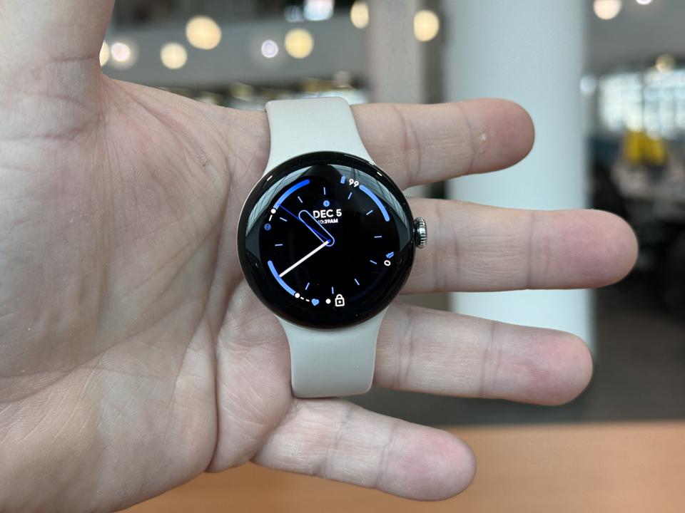 Pixel Watch 2 being held in a hand...