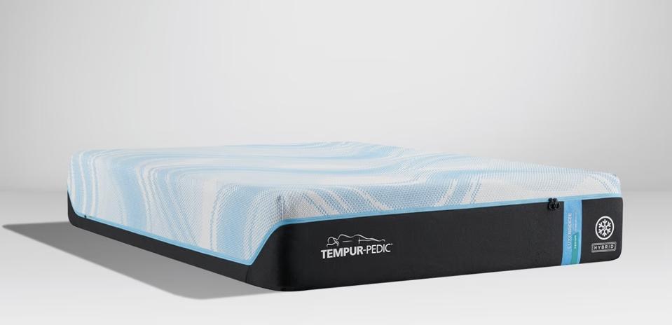 The Tempur-LuxeBreeze Medium Hybrid mattress against a grey background.