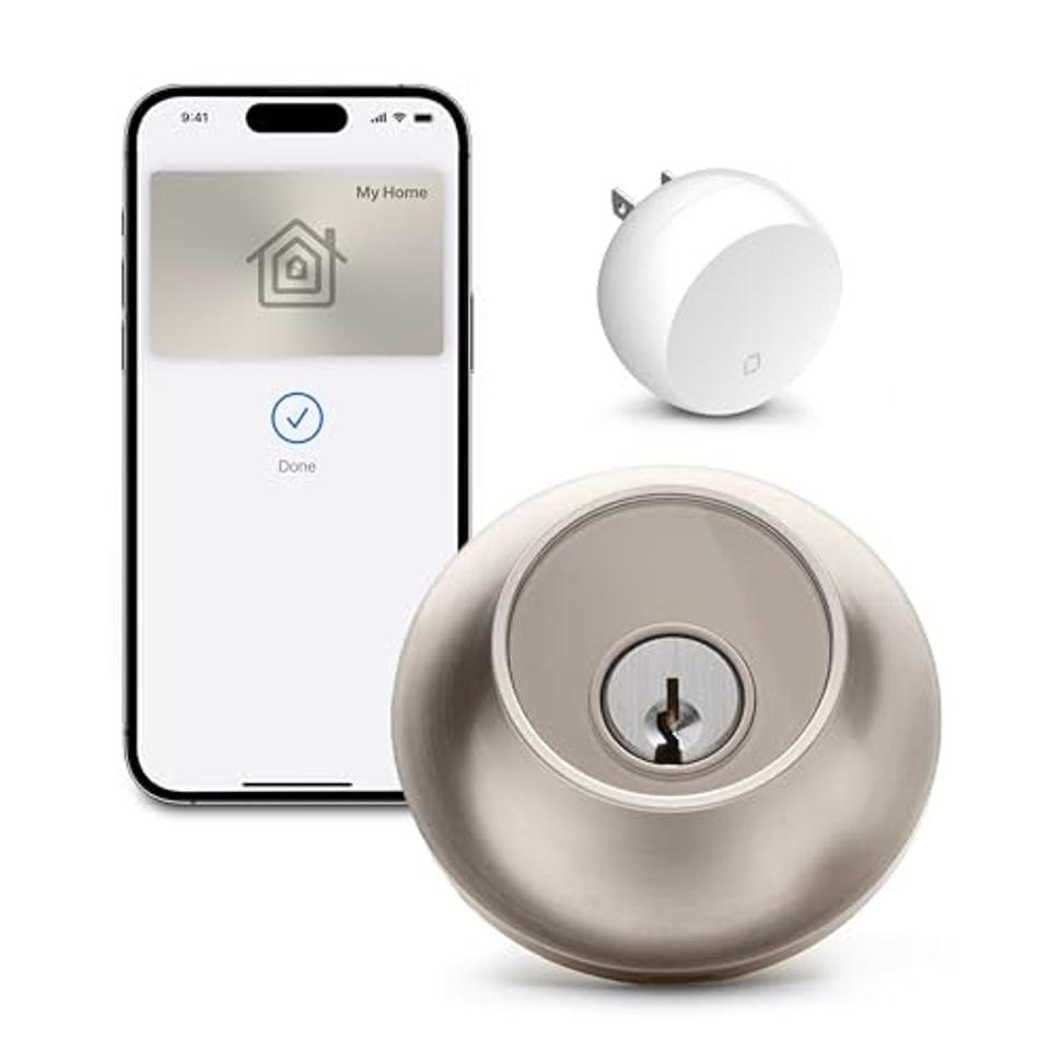 Level Lock+ Connect device, the smart plug and a cell phone on a white background