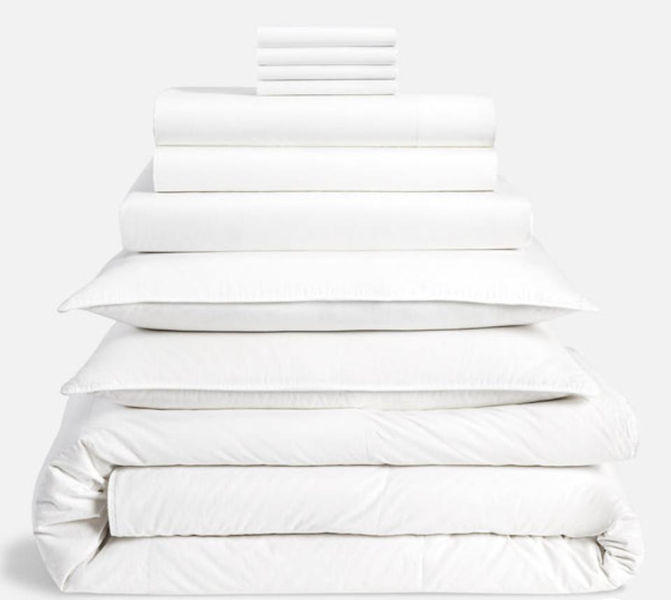 Brooklinen Luxe Sateen Move-In Bundle in white stacked on a white background.